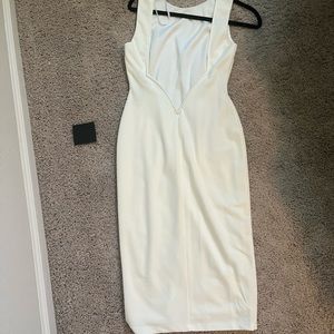 Backless white form fitting dress! Never worn, tags on!